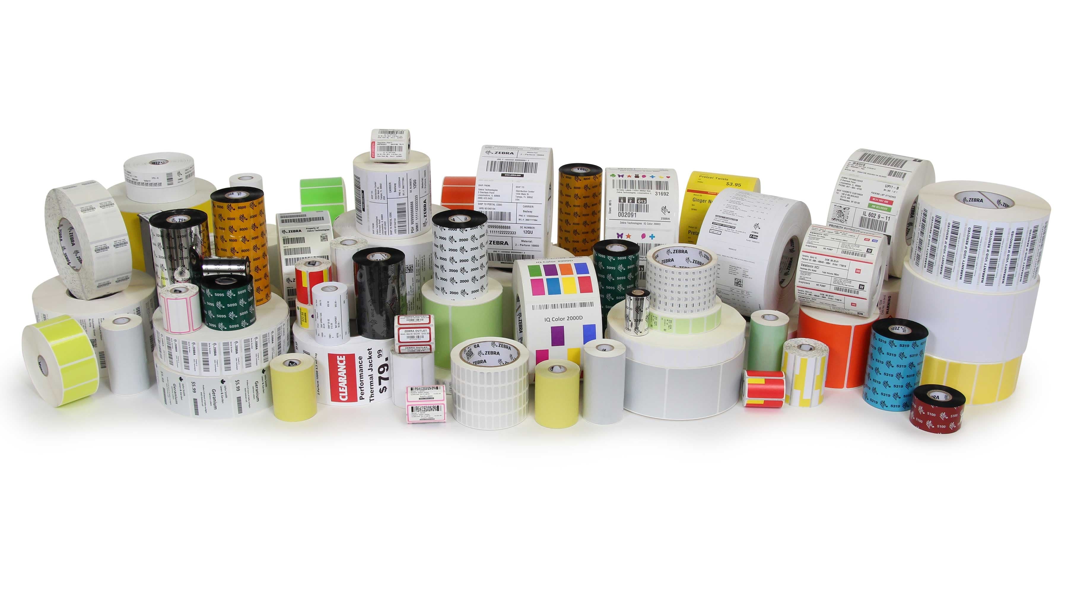 Stock thermal label rolls and transfer ribbons — shipping, retail, and industrial dies